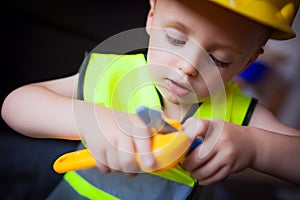 Boy with a Boss builder helmet