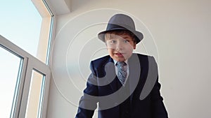 Boy Boss in Classical Suit and Hat Talk to Camera