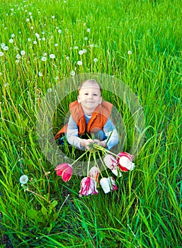 The boy with a bouquet of tulips