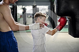 Boy Boxing Training Punching Bag Exercise Concept