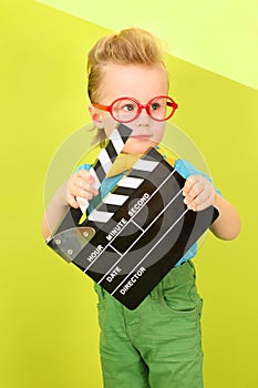 A boy in a bright clothes and red big