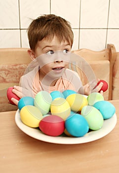 Boy with brightly colored eggs