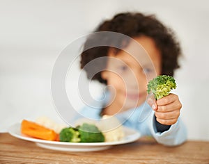 Boy, broccoli and vegetables plate unhappy for healthy nutrition meal, diner fail or frustrated eating. Male, kid and