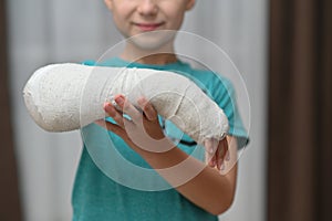 a boy with a broken arm in a cast. close-up.