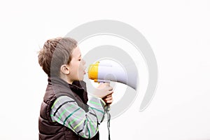 Boy in the brown vest shouts into the megaphone