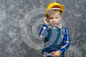 The boy-Builder holds the phone in his hands