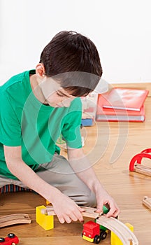 Boy building racetrack