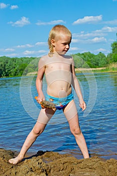 Boy builds a sand photo