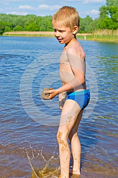 Boy builds a sand photo