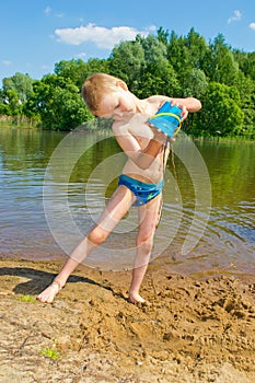 Boy builds a sand photo