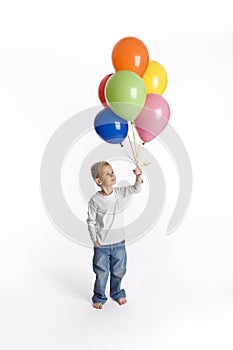 Boy with bunch of balloons