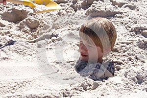 Boy Buried in Sand