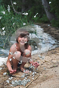 Boy and butterflies photo