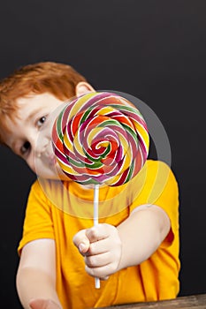 a boy with candy Lollipop