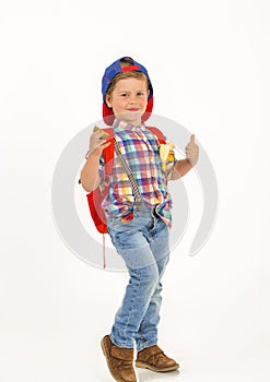 Boy with cap and backpack with fruit in his pockets