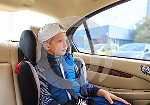 Boy in car safety seat. Safety concept