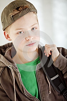 Boy carrying backpack on his way to school