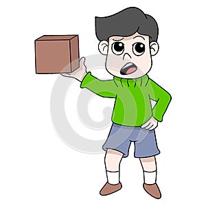 Boy carrying a cardboard box package online shop that has been purchased