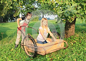 Boy carrying a girl on carriage