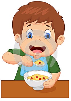 Boy cartoon is having cereal for breakfast