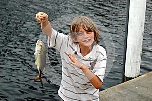 Boy catches fish