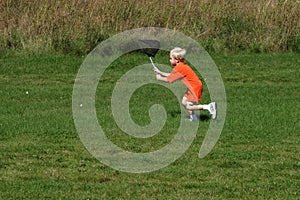 Boy Catching Bugs