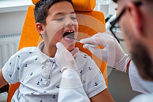 Boy at check-up at aryngologist