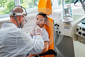 Boy at check-up at aryngologist