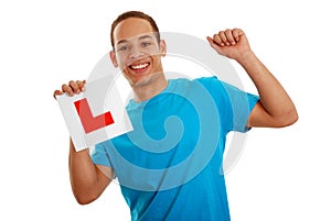 Boy cheering with L plate