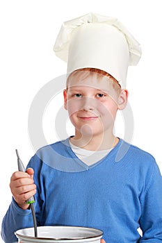 Boy in chef's hat with ladle and pan