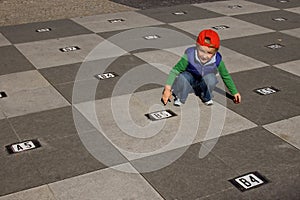 Boy and chessboard