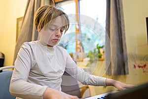 Boy with chickenpox playing piano