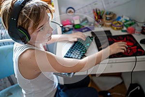 Boy with chickenpox playing video games