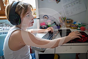 Boy with chickenpox playing video games