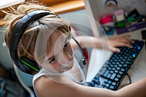 Boy with chickenpox playing video games