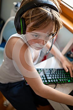 Boy with chickenpox playing video games