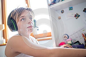 Boy with chickenpox playing video games