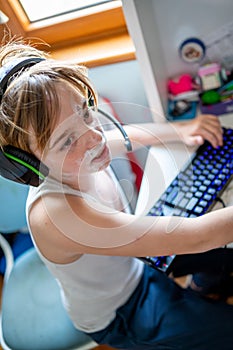 Boy with chickenpox playing video games