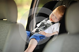Boy in child car seat