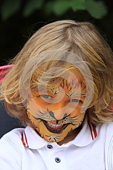 A boy child painted as a lion