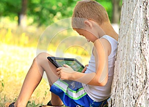 Boy Child playing with Tablet PC