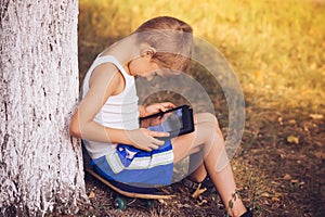 Boy Child playing with Tablet PC Outdoor