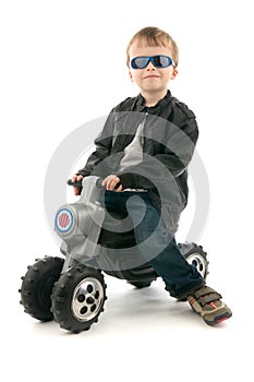 Boy on child's motorcycle