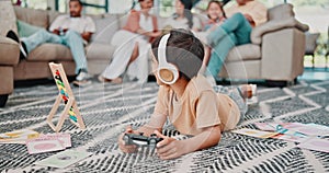 Boy, child and video games with headphones in home on floor with console, fun and happiness in living room. Gaming