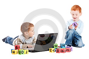 Boy children class with computer and kids alphabet