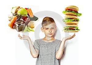 Boy chooses between healthy food and fast food