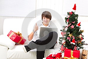 Boy on Christmas Eve with laptop