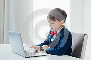 boy in the classroom at the computer online education skype communication