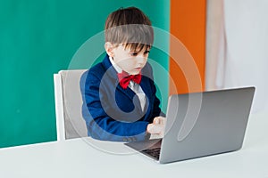 boy in the classroom at the computer online education skype communication