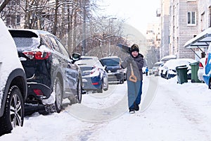 A boy cleaning snow in St. Petersburg